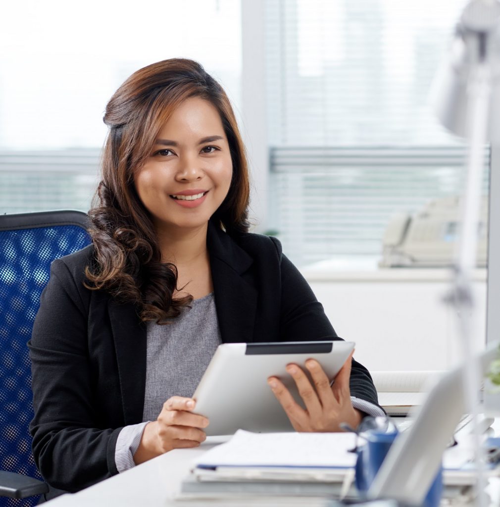 Filipino virtual assistant sitting in front of computer